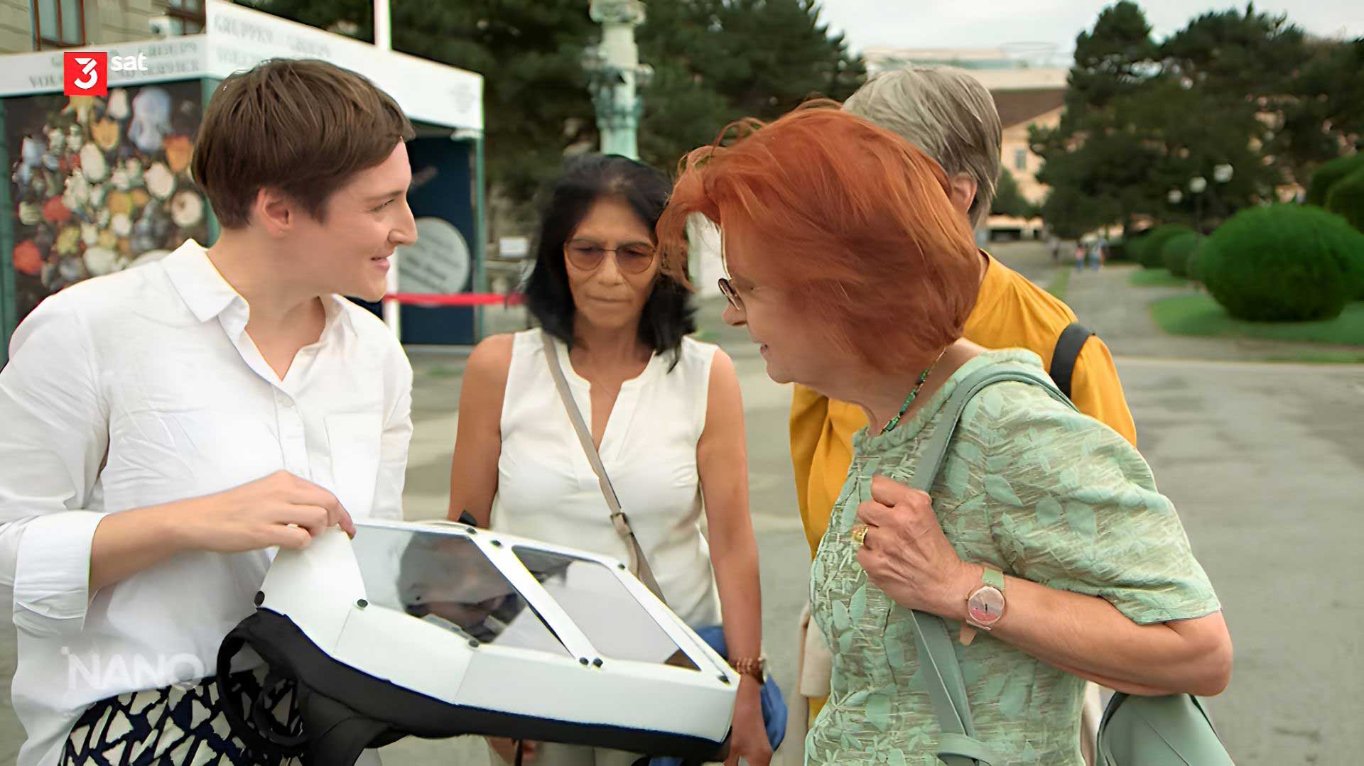 Georg Regal, The BeauCoup Project project manager, showing The BackPack to people